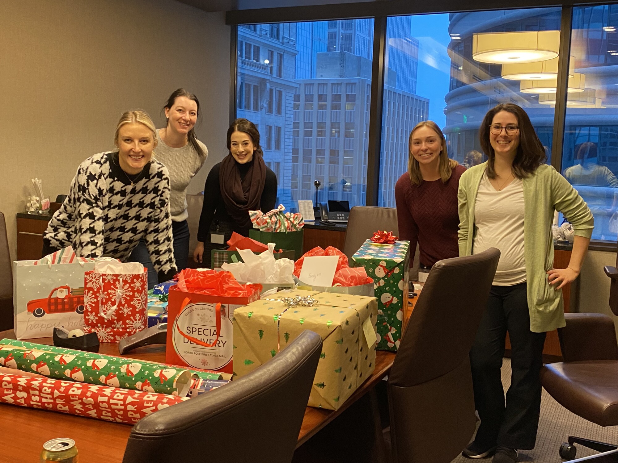 Moss & Barnett Women Attorneys Wrapping Gifts for Breaking Free